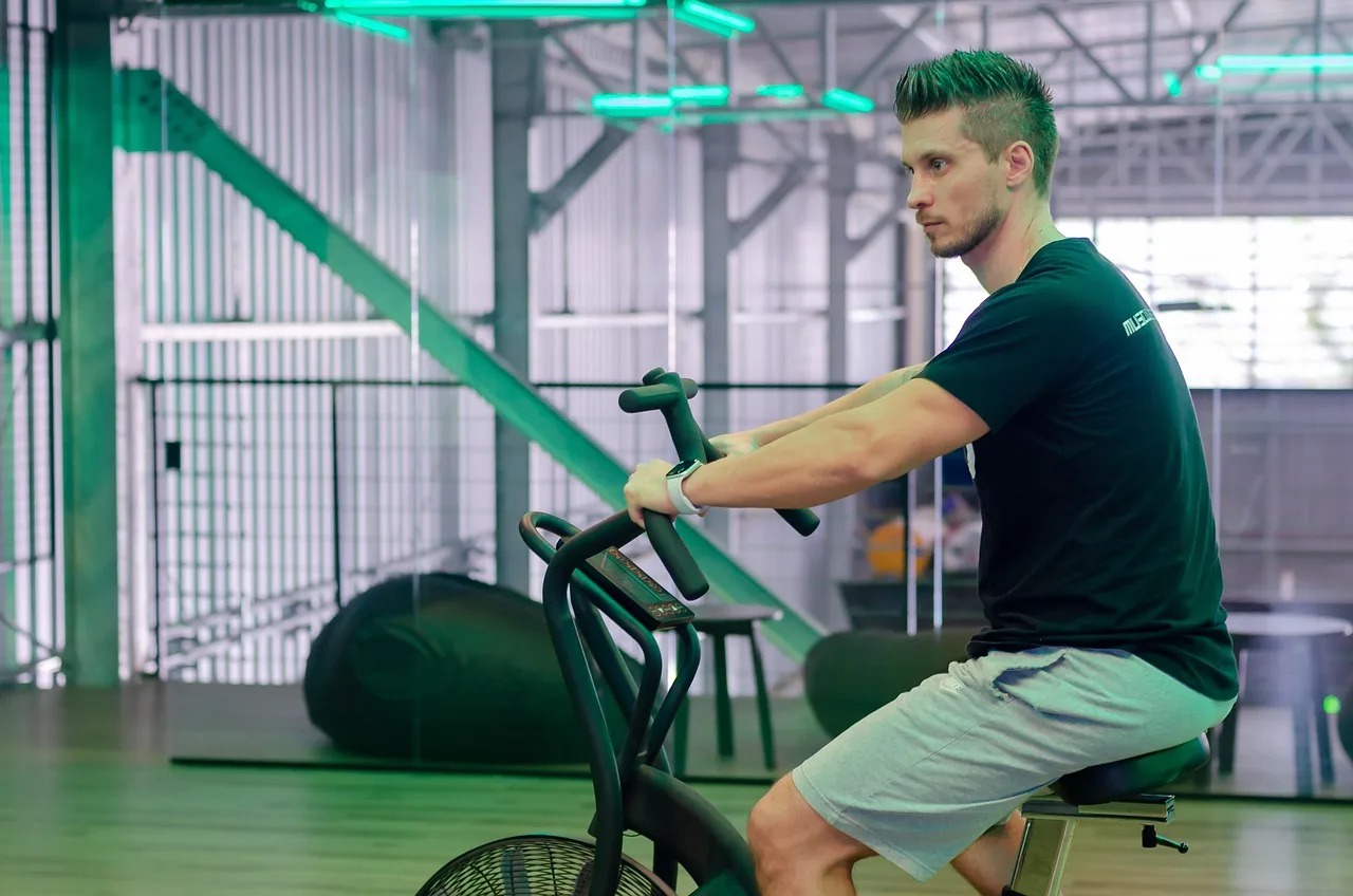 exercise bicycle, workout, gym, exercise bike, spinning bike, stationary bike, exercise, wellness, cardio, man, exercise bike, spinning bike, stationary bike, stationary bike, stationary bike, cardio, cardio, cardio, cardio, cardio. Spin Class Capacity vs Yoga: US Spacing and Safety Rules